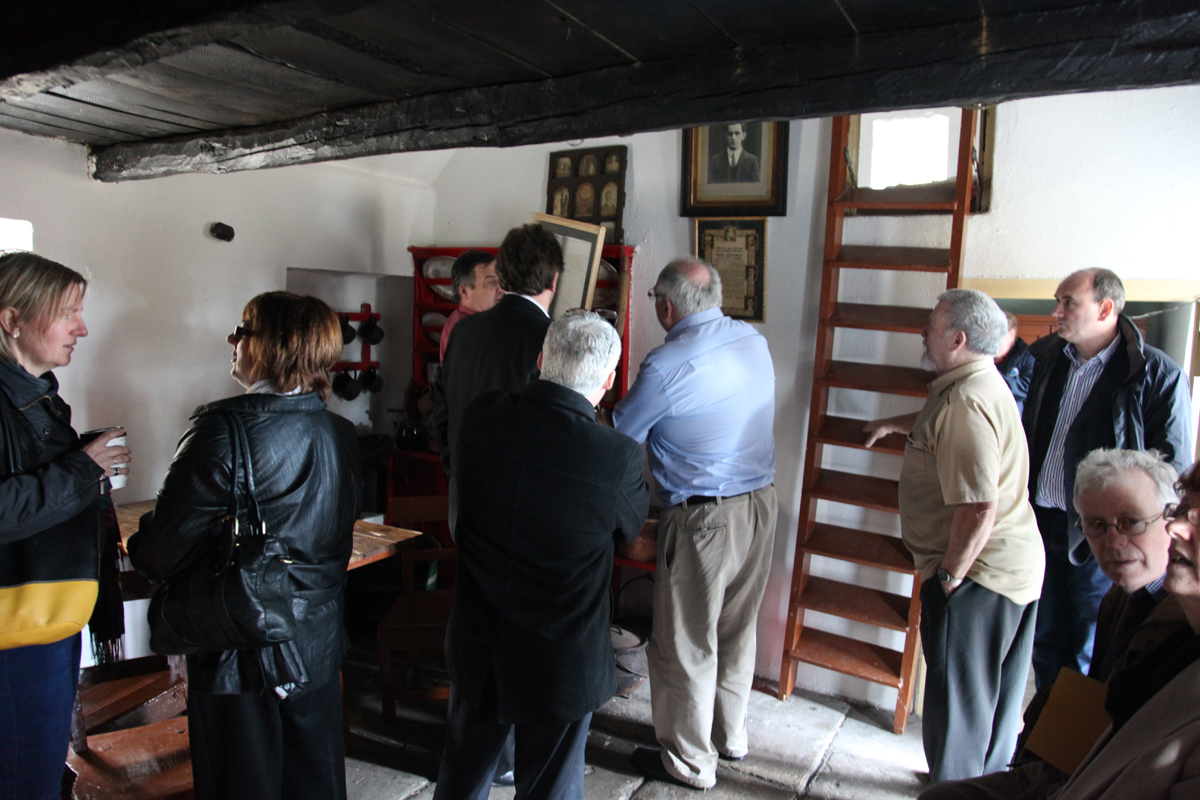 Visitors inside Sean Mac Diarmada's homestead
